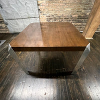 Stunning and unique mid-century dining table by Baker Furniture that features a rich brown wood top and triangular shaped polished chrome legs. Studio Sonja Milan, Chicago, IL