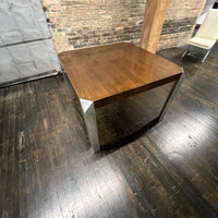 Stunning and unique mid-century dining table by Baker Furniture that features a rich brown wood top and triangular shaped polished chrome legs. Studio Sonja Milan, Chicago, IL