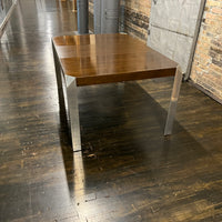 Stunning and unique mid-century dining table by Baker Furniture that features a rich brown wood top and triangular shaped polished chrome legs. Studio Sonja Milan, Chicago, IL