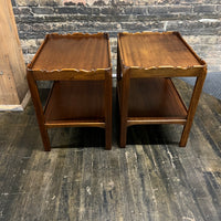 Lovely pair of scalloped edge side tables that appear to be English walnut. They have soft curves, a lower level and amazing patina. Chicago, IL Studio Sonja Milan