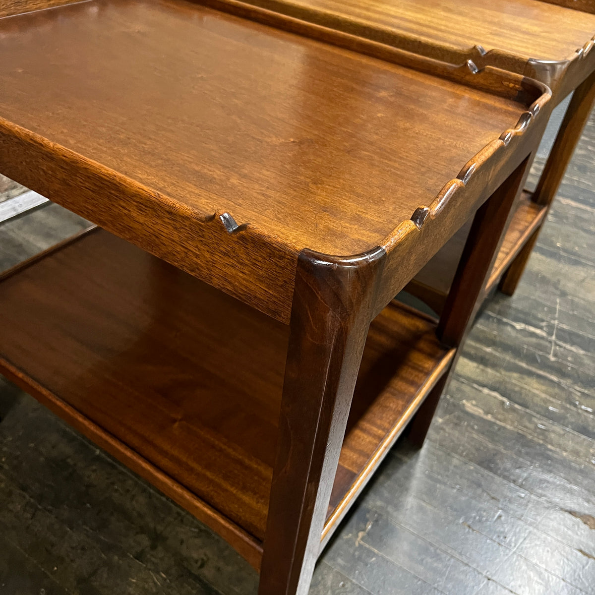 Lovely pair of scalloped edge side tables that appear to be English walnut. They have soft curves, a lower level and amazing patina. Chicago, IL Studio Sonja Milan