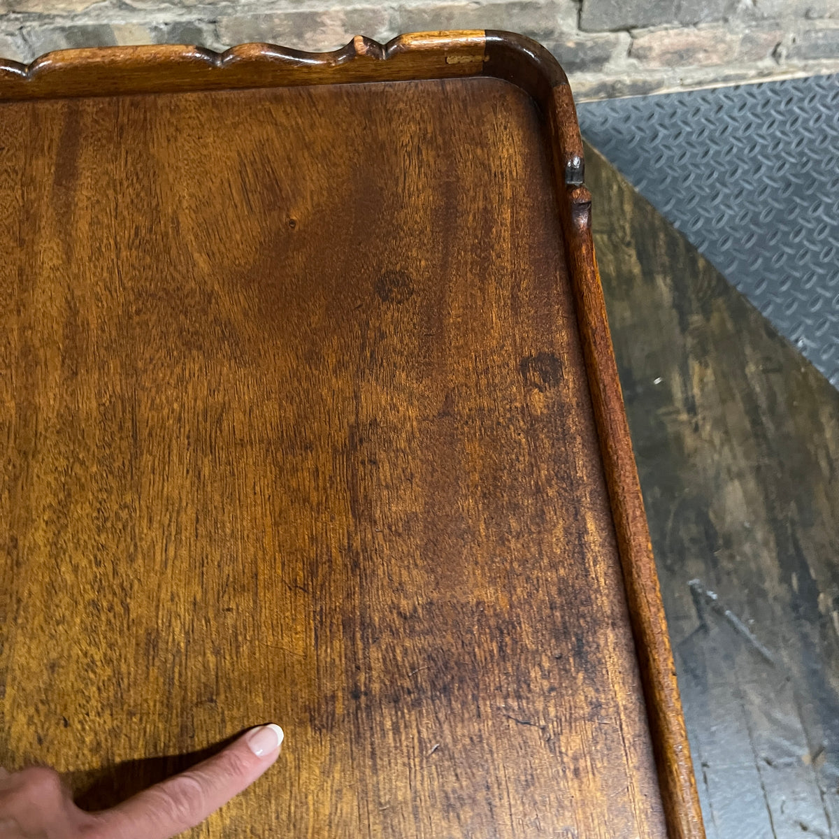 Lovely pair of scalloped edge side tables that appear to be English walnut. They have soft curves, a lower level and amazing patina. Chicago, IL Studio Sonja Milan