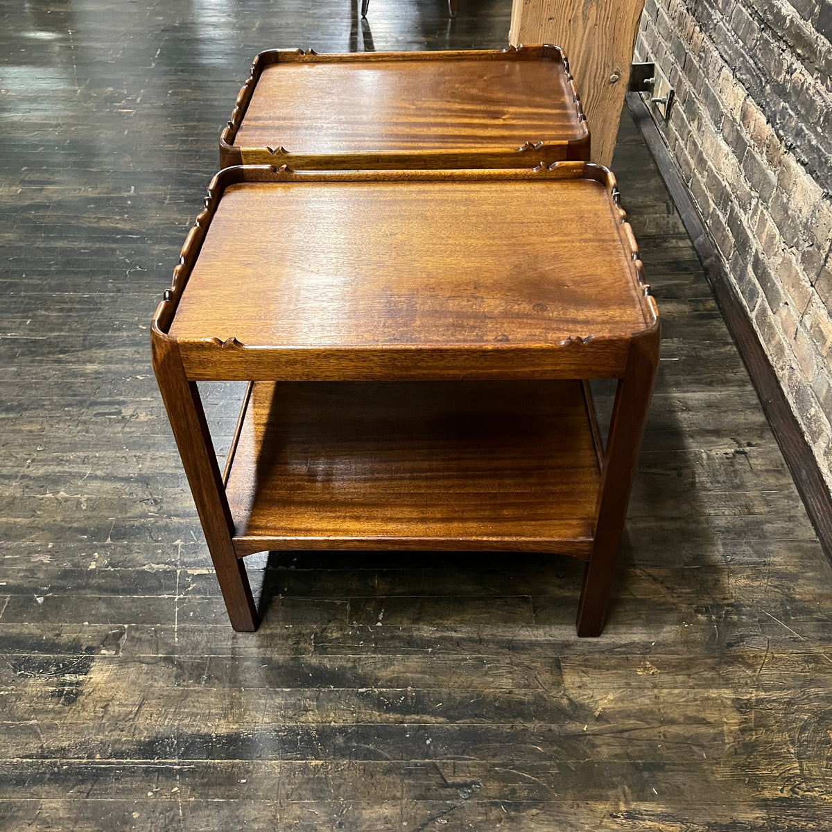 Lovely pair of scalloped edge side tables that appear to be English walnut. They have soft curves, a lower level and amazing patina. Chicago, IL Studio Sonja Milan
