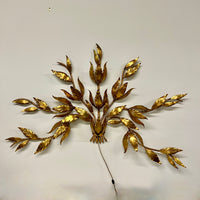 Stunning large gilded wall sconce by Hans Kogl. It has seven arms that have gilded leaves on branches.  Lights are hidden behind certain leaves.  Hollywood Regency Style.  Mid-century corded sconce.