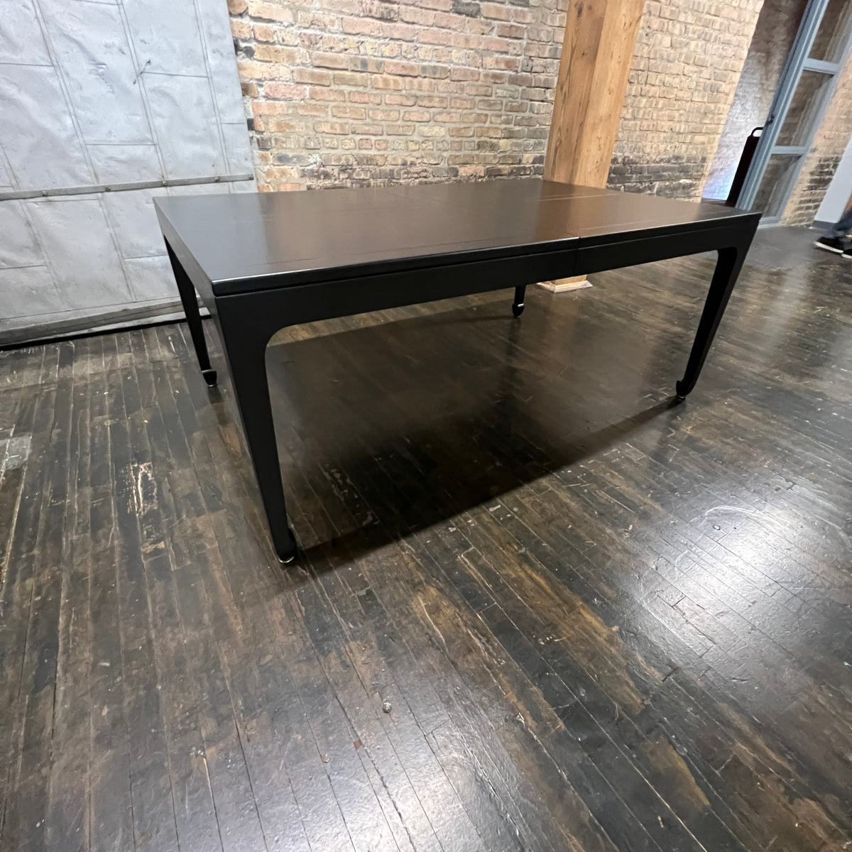 A refinished extension table that Michael Taylor designed for Baker Furniture.  This table starts out as a rectangle but with three impressive leaves it can extend to 122".  It was part of the Far East Collection he did for Baker. Chicago, IL Studio Sonja Milan