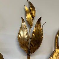 Stunning large gilded wall sconce by Hans Kogl. It has seven arms that have gilded leaves on branches.  Lights are hidden behind certain leaves.  Hollywood Regency Style.  Mid-century corded sconce.