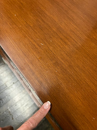 A walnut console cabinet by Berman Rosetti. The piece has 2 doors that slide open to reveal storage inside (one adjustable shelf on either side).  Chicago