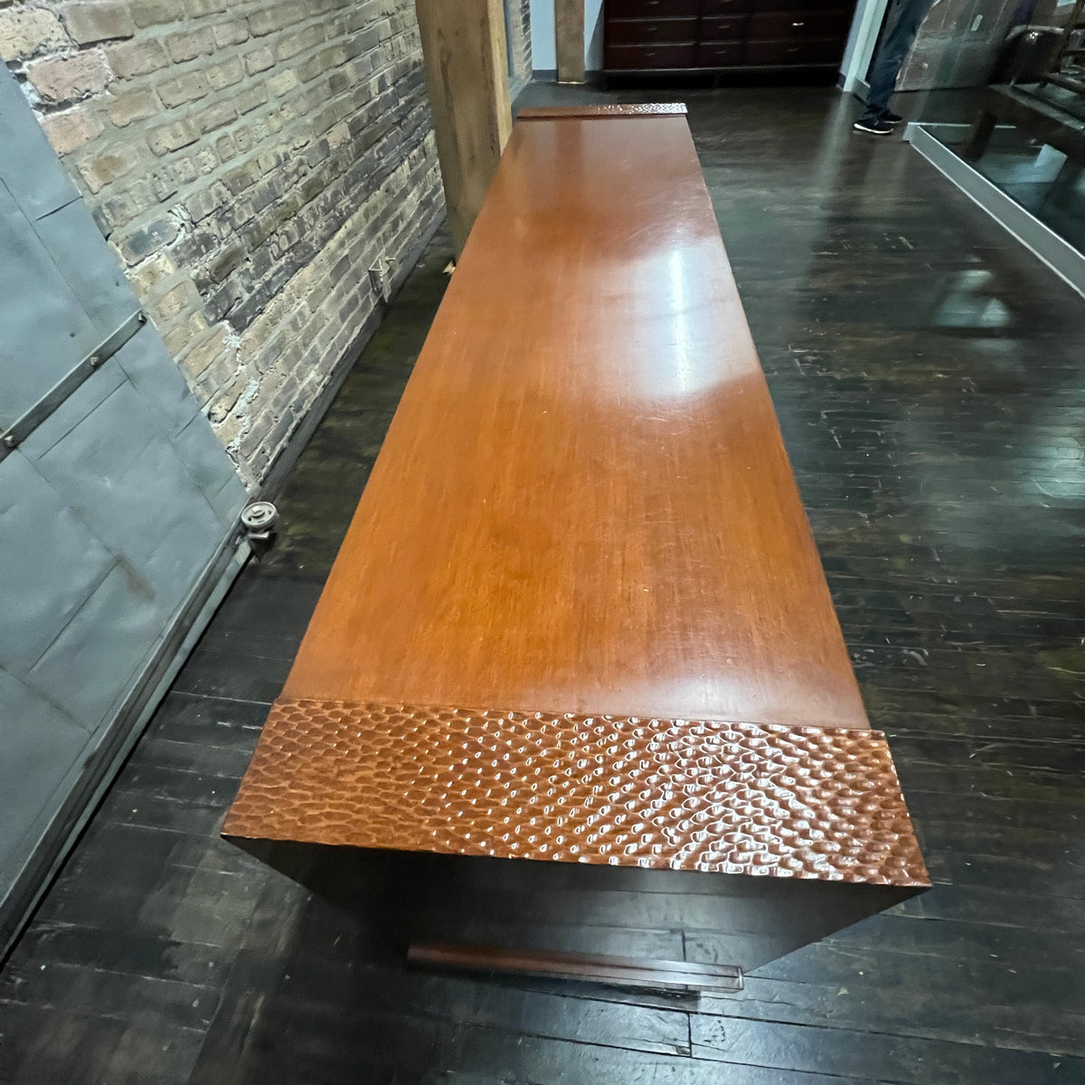 A walnut console cabinet by Berman Rosetti. The piece has 2 doors that slide open to reveal storage inside (one adjustable shelf on either side).  Chicago