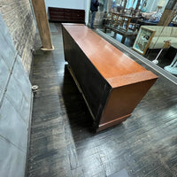 A walnut console cabinet by Berman Rosetti. The piece has 2 doors that slide open to reveal storage inside (one adjustable shelf on either side).  Chicago