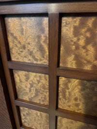 A walnut console cabinet by Berman Rosetti. The piece has 2 doors that slide open to reveal storage inside (one adjustable shelf on either side).  Chicago