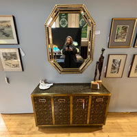 Rare brass clad two door cabinet decorated with intricate etched abstract figures designed by Bernhard Rhone for Mastercraft.  Chicago, IL Studio Sonja Milan