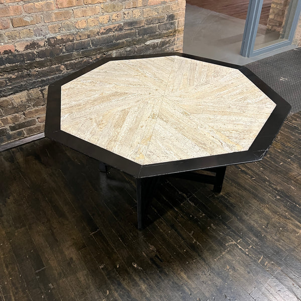 Bold octagonal table by Harvey Probber. Ebonized cross form base and a parquet like travertine top that is inset with an ebonized wood border. Chicago, IL, Studio Sonja Milan