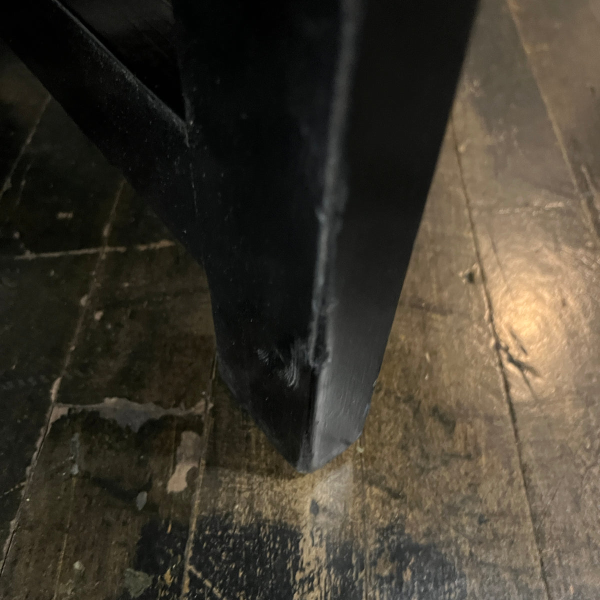 Bold octagonal table by Harvey Probber. Ebonized cross form base and a parquet like travertine top that is inset with an ebonized wood border. Chicago, IL, Studio Sonja Milan