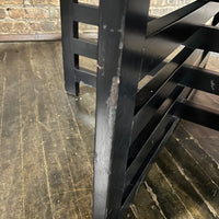 Bold octagonal table by Harvey Probber. Ebonized cross form base and a parquet like travertine top that is inset with an ebonized wood border. Chicago, IL, Studio Sonja Milan