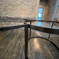 Stunning and impressive solid bronze dining table on an open pedestal base with red lacquer table top.  78" round.  Chicago, IL Studio Sonja Milan