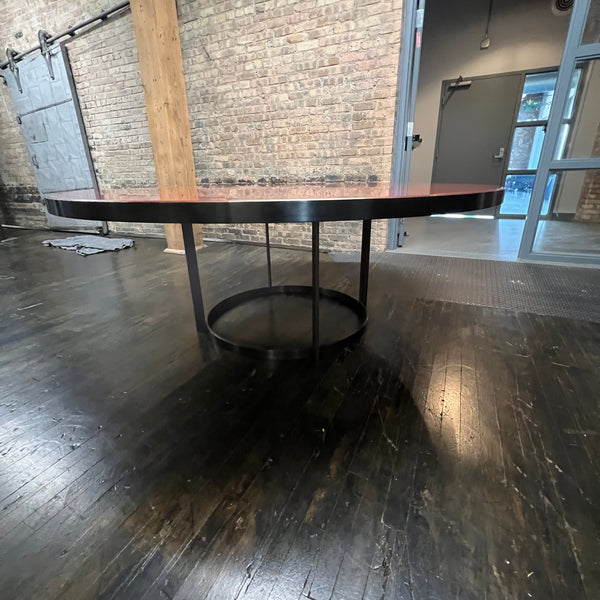 Stunning and impressive solid bronze dining table on an open pedestal base with red lacquer table top.  78" round.  Chicago, IL Studio Sonja Milan