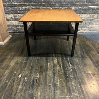 Lovely mid-century modern occasional table circa 1950.  Designed by Edward Wormley for Dunbar Furniture.  This walnut table has a lacquered wood base with leather trim near the feet.  The table is in vintage condition.  Studio Sonja Milan, Chicago, IL