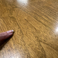 Lovely mid-century modern occasional table circa 1950.  Designed by Edward Wormley for Dunbar Furniture.  This walnut table has a lacquered wood base with leather trim near the feet.  The table is in vintage condition.  Studio Sonja Milan, Chicago, IL