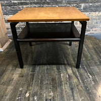 Lovely mid-century modern occasional table circa 1950.  Designed by Edward Wormley for Dunbar Furniture.  This walnut table has a lacquered wood base with leather trim near the feet.  The table is in vintage condition.  Studio Sonja Milan, Chicago, IL