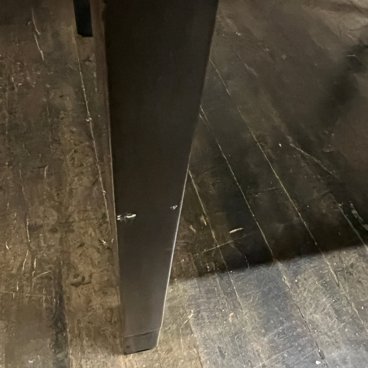 Lovely mid-century modern occasional table circa 1950.  Designed by Edward Wormley for Dunbar Furniture.  This walnut table has a lacquered wood base with leather trim near the feet.  The table is in vintage condition.  Studio Sonja Milan, Chicago, IL
