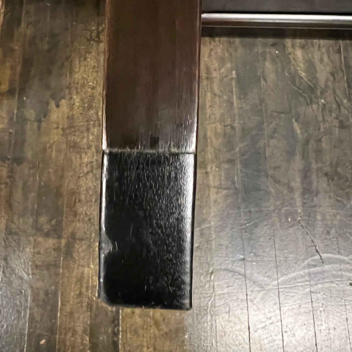 leather trim at base of table leg