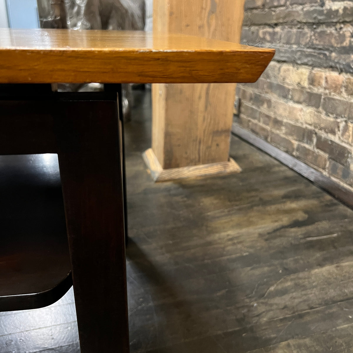 Lovely mid-century modern occasional table circa 1950.  Designed by Edward Wormley for Dunbar Furniture.  This walnut table has a lacquered wood base with leather trim near the feet.  The table is in vintage condition.  Studio Sonja Milan, Chicago, IL