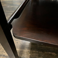 Lovely mid-century modern occasional table circa 1950.  Designed by Edward Wormley for Dunbar Furniture.  This walnut table has a lacquered wood base with leather trim near the feet.  The table is in vintage condition.  Studio Sonja Milan, Chicago, IL