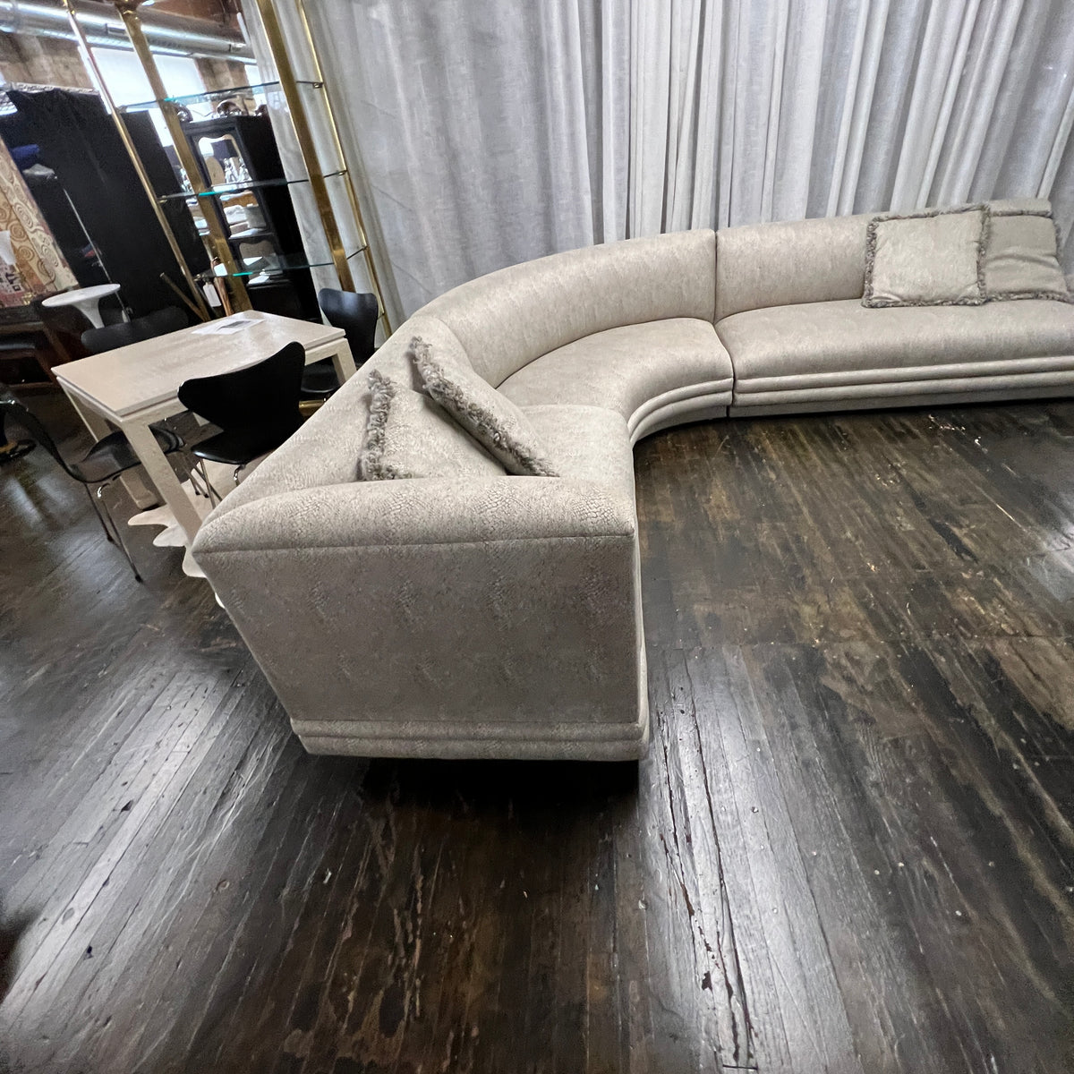 Mid-century curved sectional sofa attributed to Vladimir Kagan for Weiman Furniture. upholstered in a stunning neutral faux snakeskin fabric.