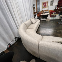 Mid-century curved sectional sofa attributed to Vladimir Kagan for Weiman Furniture. upholstered in a stunning neutral faux snakeskin fabric.