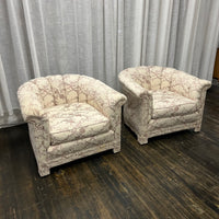 Pair of Art Deco Style Channel Back Lounge Chairs attributed to Baker.  reupholstered some time in the late 70's.  The existing fabric has shades of mauve and lavender on a cream colored background. The fabric is in good shape....but there are some stains at the base of the chair and the arms.  Chicago, IL