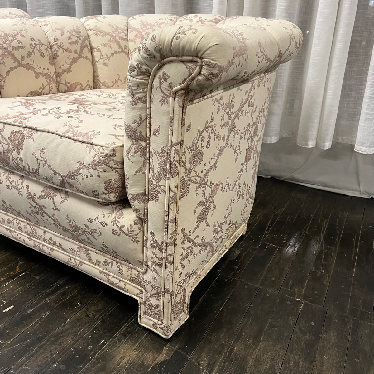 Pair of Art Deco Style Channel Back Lounge Chairs attributed to Baker.  reupholstered some time in the late 70's.  The existing fabric has shades of mauve and lavender on a cream colored background. The fabric is in good shape....but there are some stains at the base of the chair and the arms.  Chicago, IL