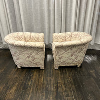 Pair of Art Deco Style Channel Back Lounge Chairs attributed to Baker.  reupholstered some time in the late 70's.  The existing fabric has shades of mauve and lavender on a cream colored background. The fabric is in good shape....but there are some stains at the base of the chair and the arms.  Chicago, IL