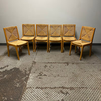 Set of 6 dining chairs with woven rush seats and backs.  Mid-century modern meets French country.  Light wood.  Vintage with some imperfections.