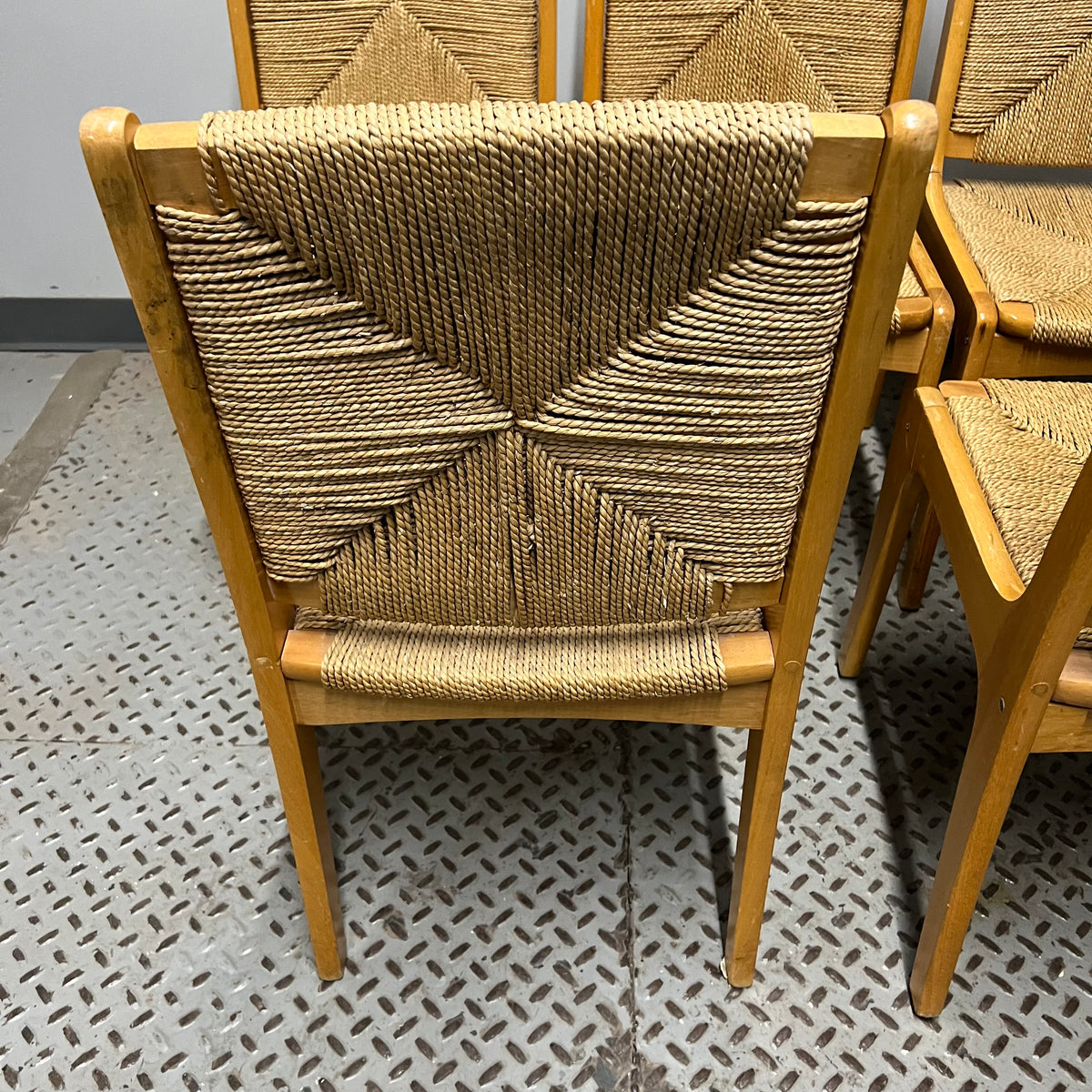 Set of 6 dining chairs with woven rush seats and backs.  Mid-century modern meets French country.  Light wood.  Vintage with some imperfections.