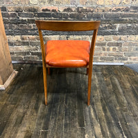 Mid century walnut dining chair by Bertha Schaefer for Singer & Sons, original orange leather upholstered seats. Made in Italy. Set of 8 available.  Chicago