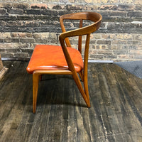 Mid century walnut dining chair by Bertha Schaefer for Singer & Sons, original orange leather upholstered seats. Made in Italy. Set of 8 available.  Chicago