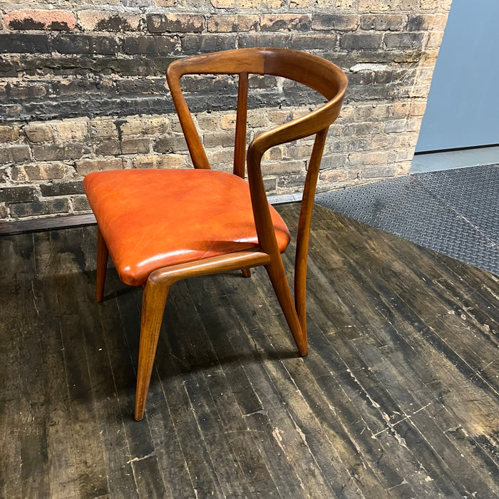 Mid century walnut dining chair by Bertha Schaefer for Singer & Sons, original orange leather upholstered seats. Made in Italy. Set of 8 available.  Chicago
