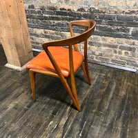 Mid century walnut dining chair by Bertha Schaefer for Singer & Sons, original orange leather upholstered seats. Made in Italy. Set of 8 available.  Chicago