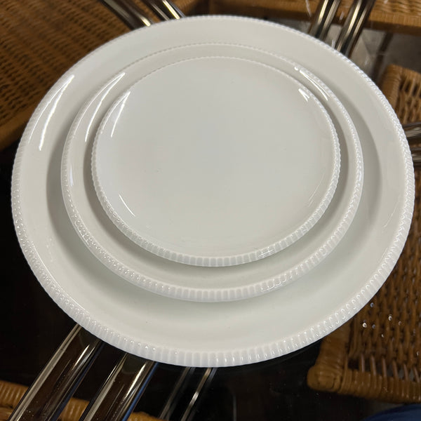 Designed by Sigvard Bernadotte for B&G. White dinner service with scalloped edges.  Dinner plates (10) , salad plates (13) and bread plates(12). Mid-Century