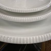 Designed by Sigvard Bernadotte for B&G. White dinner service with scalloped edges.  Dinner plates (10) , salad plates (13) and bread plates(12). Mid-Century