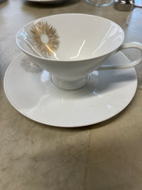 Rosenthal's Sunburst China with gilt silver and gold sunburst detail on a white field. Place settings include: dinner, salad, bread plate, cup and saucer. Gift.