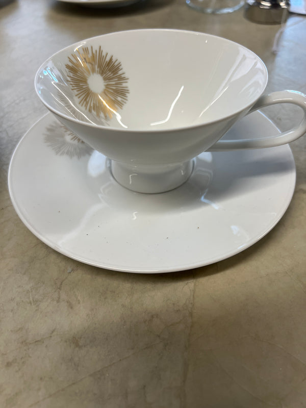 Rosenthal's Sunburst China with gilt silver and gold sunburst detail on a white field. Place settings include: dinner, salad, bread plate, cup and saucer. Gift.