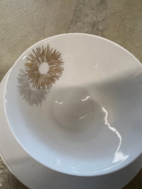 Rosenthal's Sunburst China with gilt silver and gold sunburst detail on a white field. Place settings include: dinner, salad, bread plate, cup and saucer. Gift.