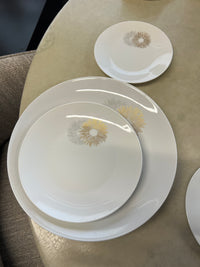 Rosenthal's Sunburst China with gilt silver and gold sunburst detail on a white field. Place settings include: dinner, salad, bread plate, cup and saucer. Gift.