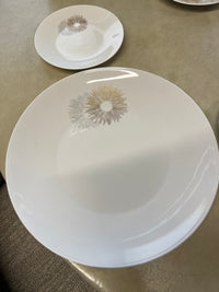 Rosenthal's Sunburst China with gilt silver and gold sunburst detail on a white field. Place settings include: dinner, salad, bread plate, cup and saucer. Gift.