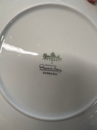 Rosenthal's Sunburst China with gilt silver and gold sunburst detail on a white field. Place settings include: dinner, salad, bread plate, cup and saucer. Gift.