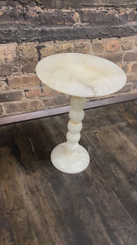 Video of petite natural stone side table