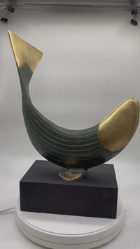 This is a beautiful modern brass and metal fish statue mounted on a stand made by Dolbi Cashier in 1990. Dolbi Cashier produced high-end decorative objects which were designed by owner Ed Schulman.  Lovely modern fish sculpture. Coastal Decor