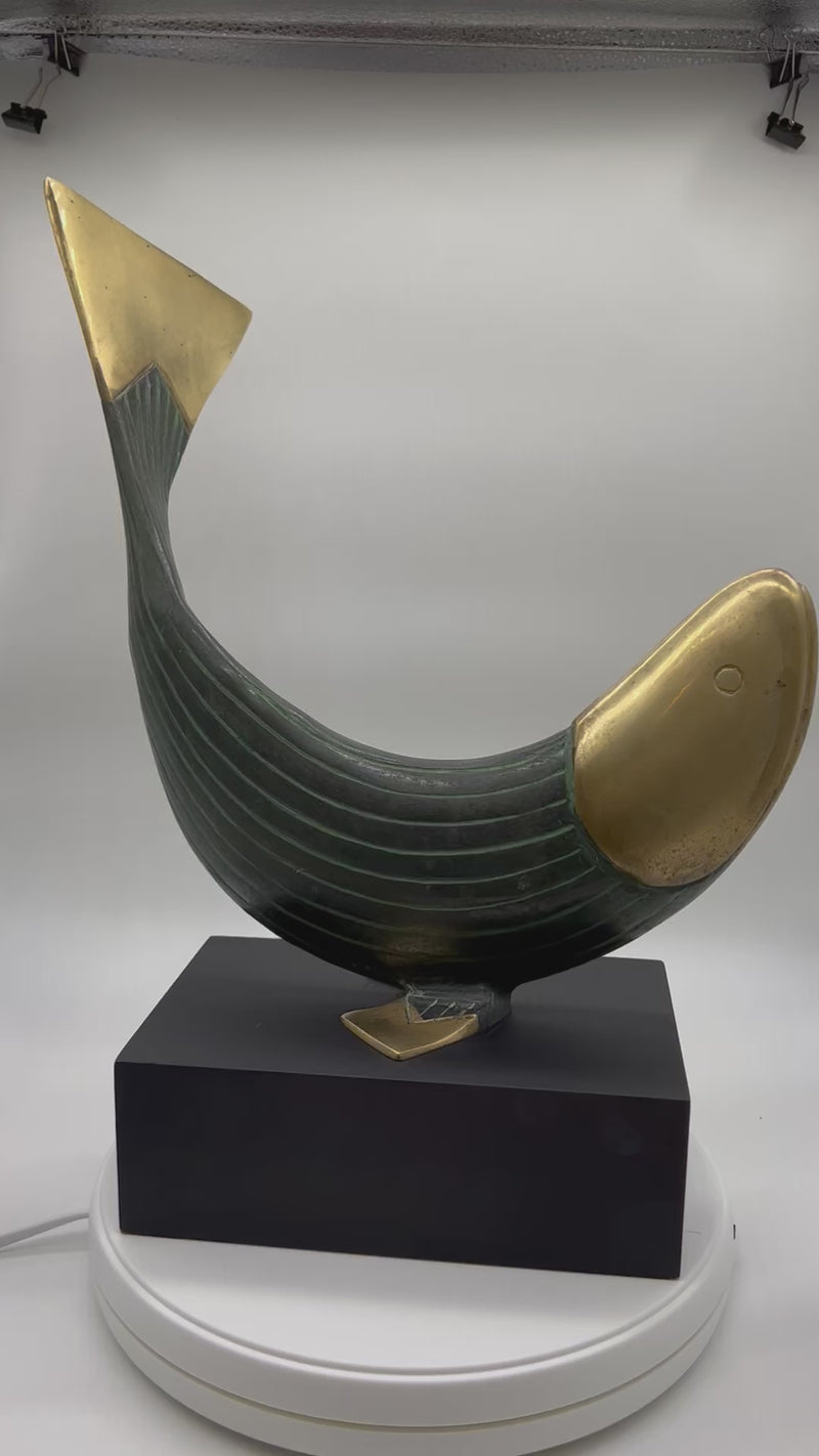 This is a beautiful modern brass and metal fish statue mounted on a stand made by Dolbi Cashier in 1990. Dolbi Cashier produced high-end decorative objects which were designed by owner Ed Schulman.  Lovely modern fish sculpture. Coastal Decor