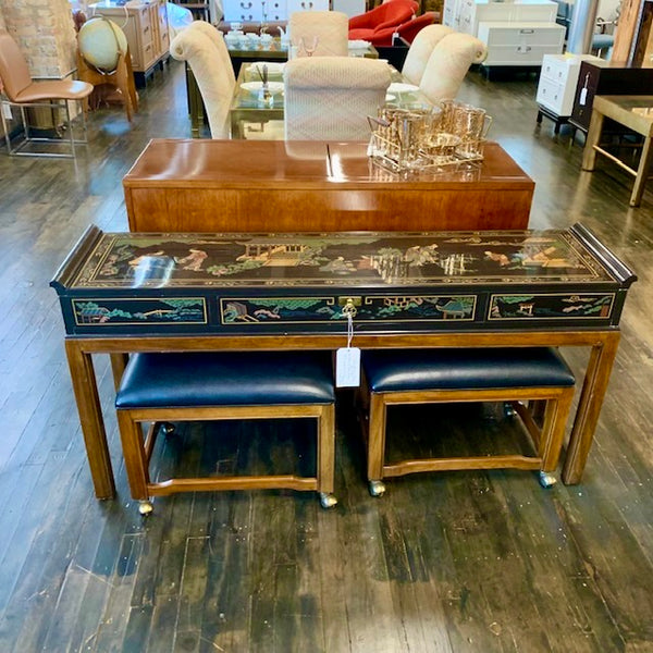 From Drexel's Et Cetera Collection, a lovely console table that has a black lacquer case with one long drawer (perfect place for keys or mail at an entrance) on walnut legs.  Case is painted with a lovely Asian scene (on all 4 sides).  Top of piece has a few scratches (see images).  It is in very good, original, vintage condition.  Has two, newly reupholstered stools on wheels (upholstery is a high-end black vinyl).  Studio Sonja Milan, Chicago